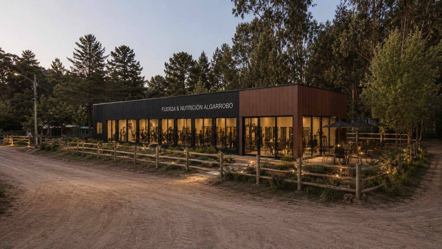 Concepto de la fachada de la sede Algarrobo entre árboles, al atardecer